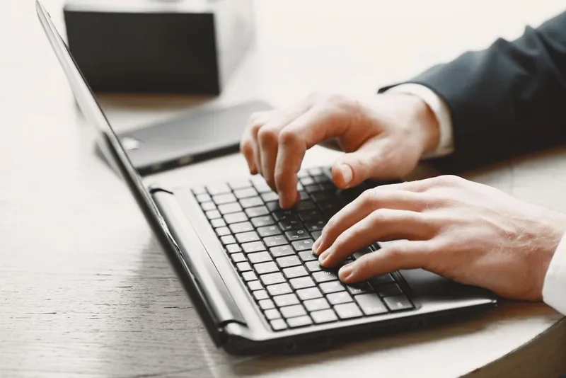 Seller reviewing store settings on a laptop while onboarding into a cross-border selling programme